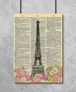 Plakat z motywem wieży Eiffla na kartce z książki